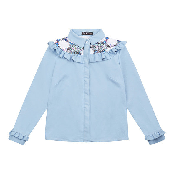 Elba denim shirt with frills. The shirt is made from light blue denim fabric with a printed yoke detail.
