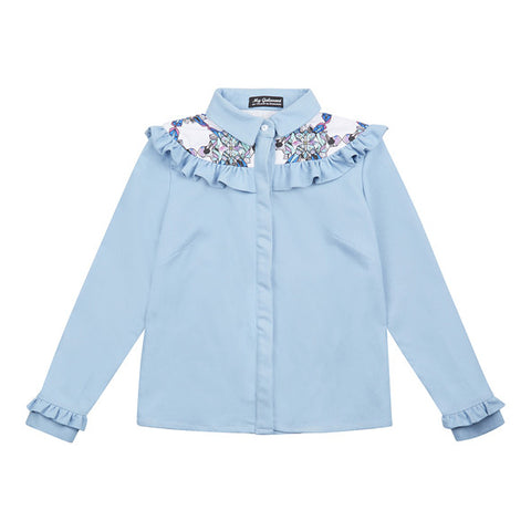Elba denim shirt with frills. The shirt is made from light blue denim fabric with a printed yoke detail.