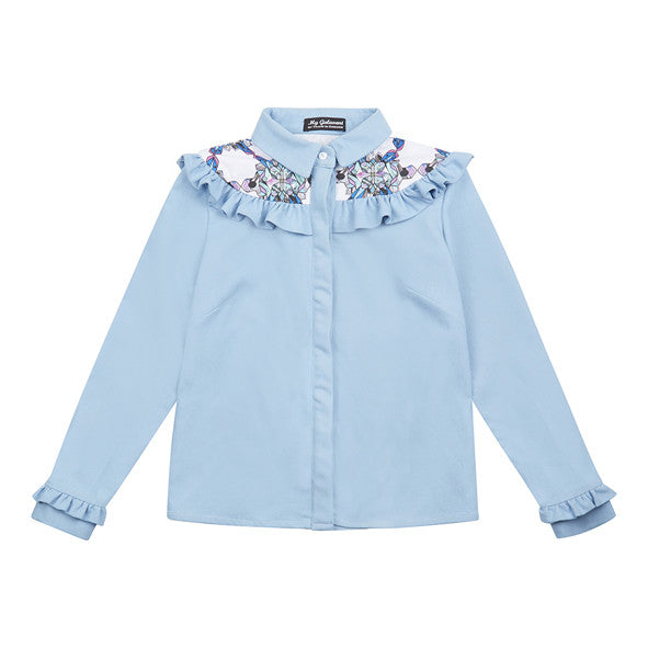 Elba denim shirt with frills. The shirt is made from light blue denim fabric with a printed yoke detail. 