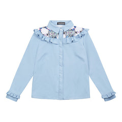 Elba denim shirt with frills. The shirt is made from light blue denim fabric with a printed yoke detail. 